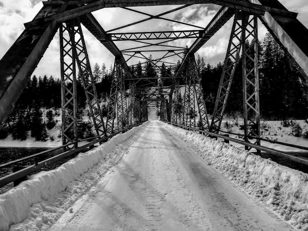 grayscale photo of metal bridge