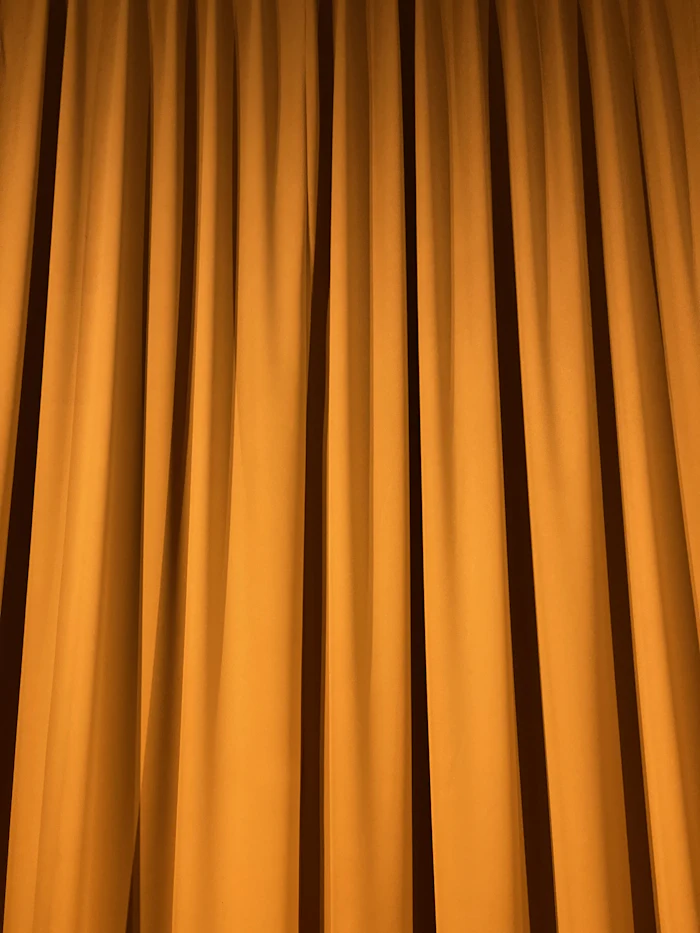 Yellow textured curtain installation detail