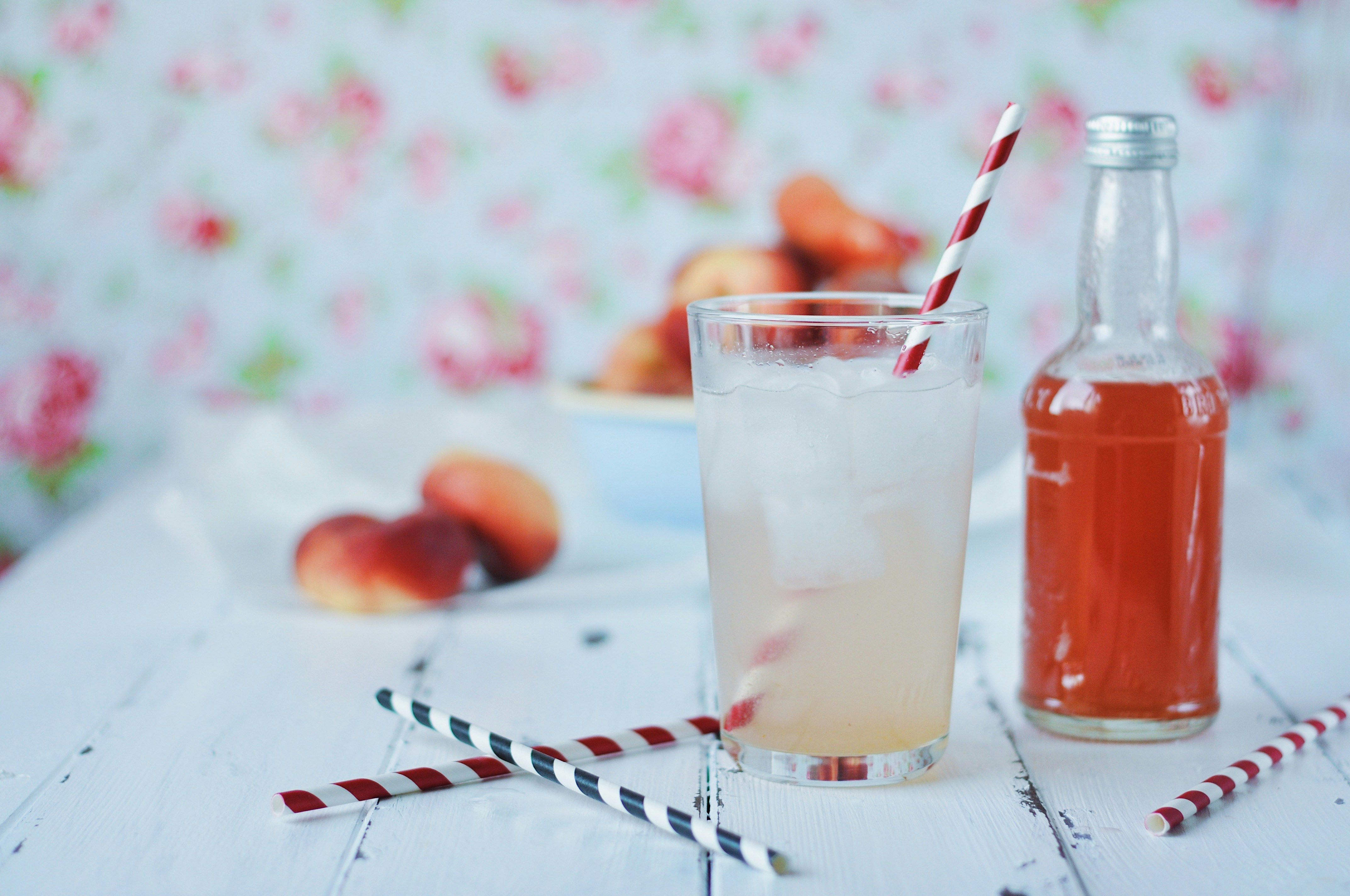clear drinking glass with orange liquid