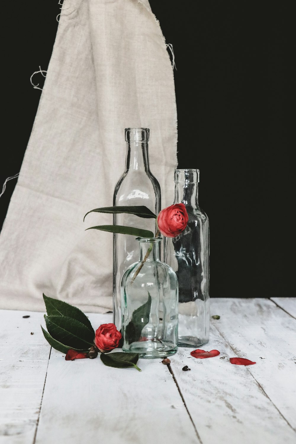 clear glass bottle with red liquid