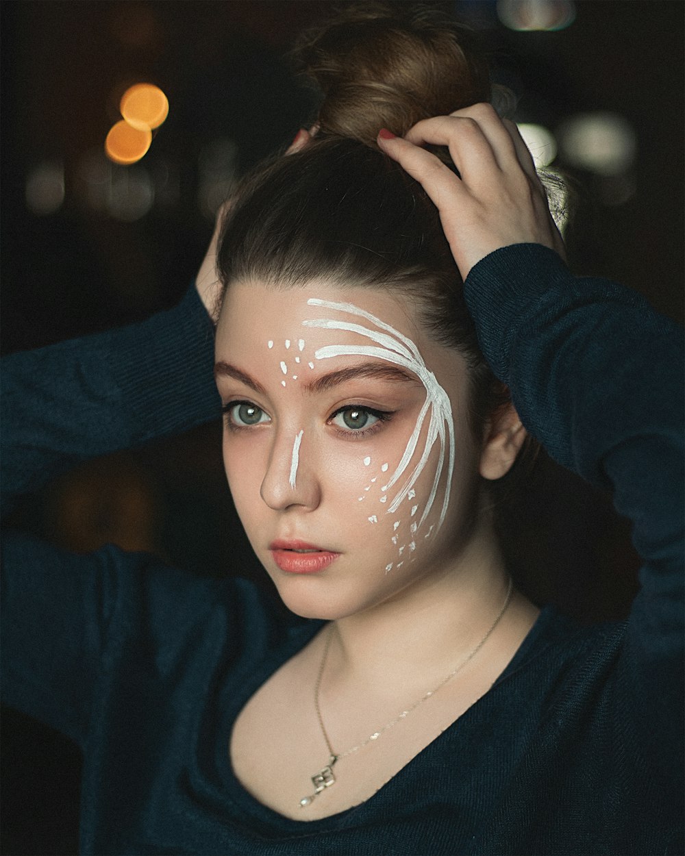 woman in black v neck long sleeve shirt with white face mask