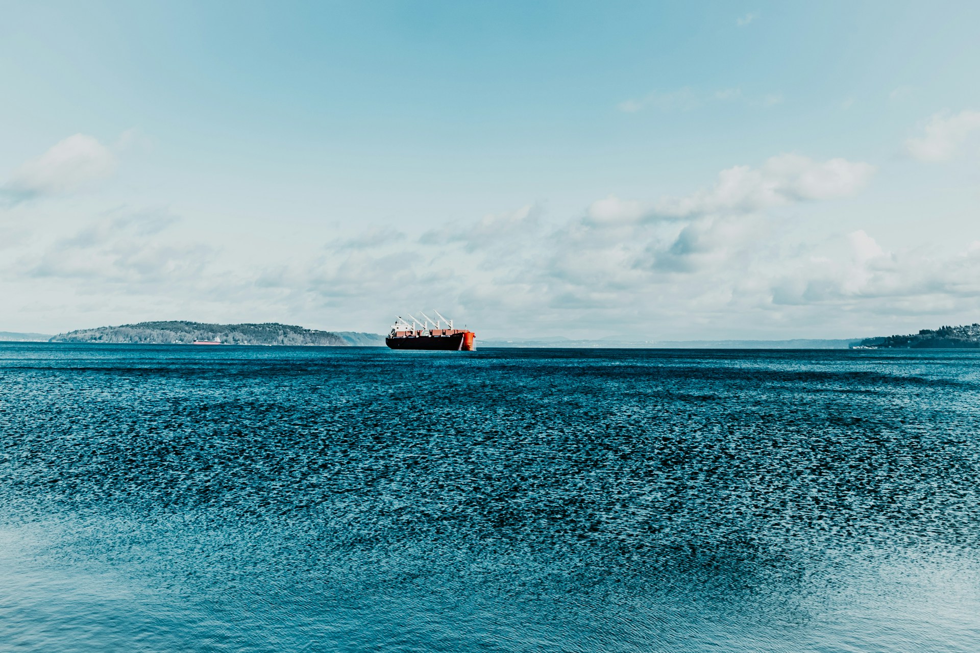 brown ship on blue sea under blue sky during daytime