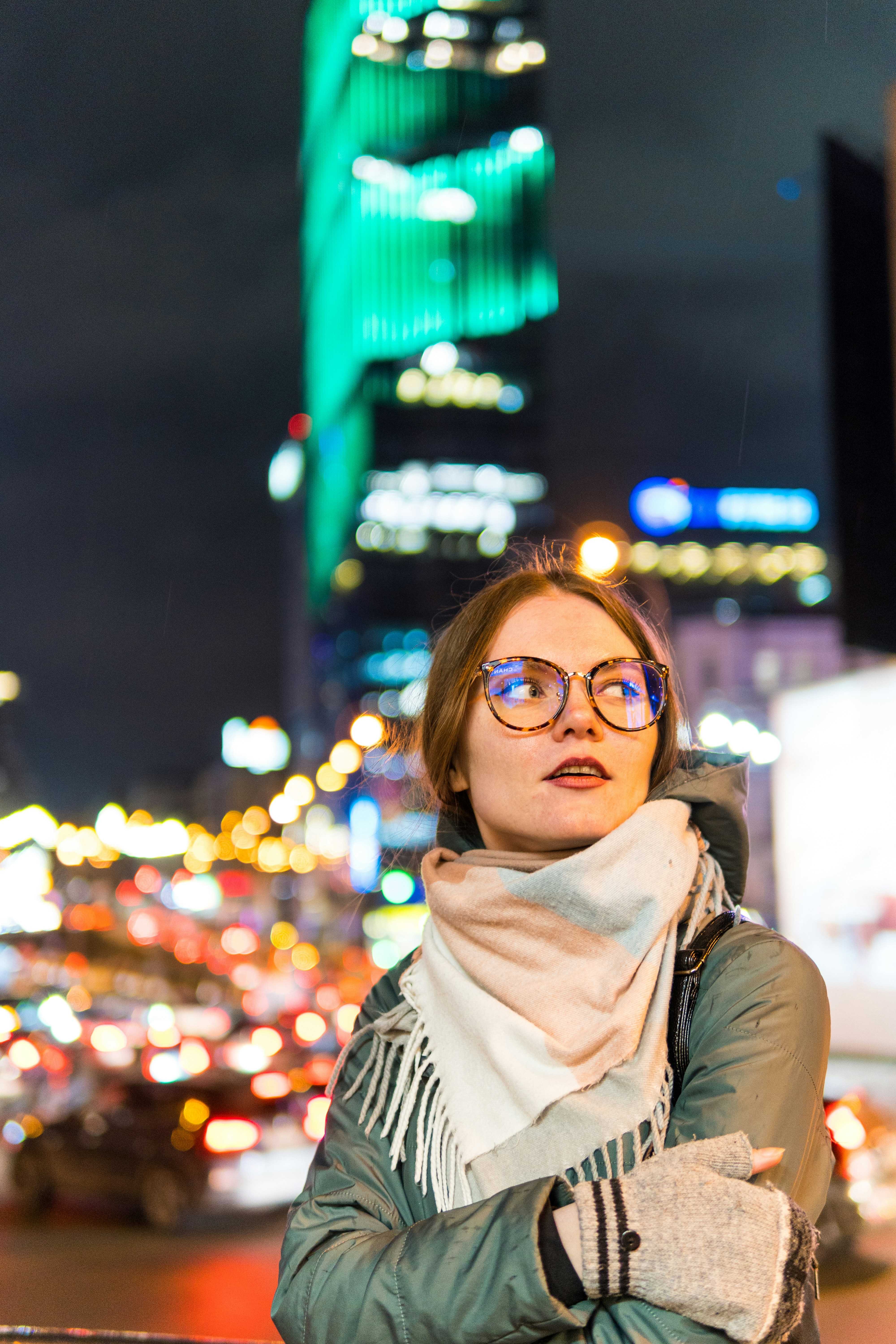 woman in black and white striped shirt wearing black framed eyeglasses