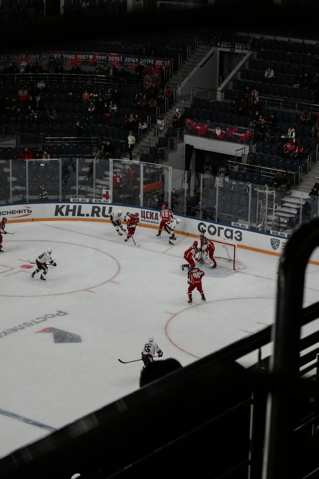 people playing ice hockey on ice stadium