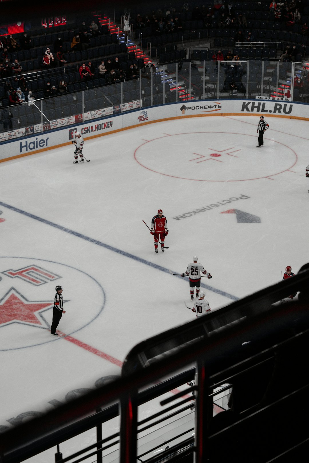 people playing ice hockey on ice stadium