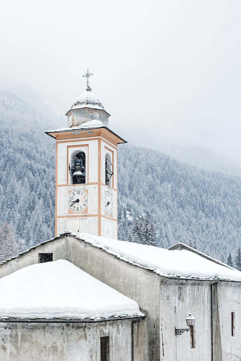 white and brown concrete building on snow covered mountain during daytime