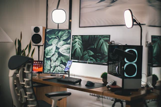 black flat screen computer monitor on white wooden desk