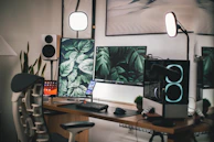 black flat screen computer monitor on white wooden desk