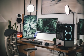 A modern workspace featuring a gamer chair and multiple tech gadgets illuminated by neon lights.