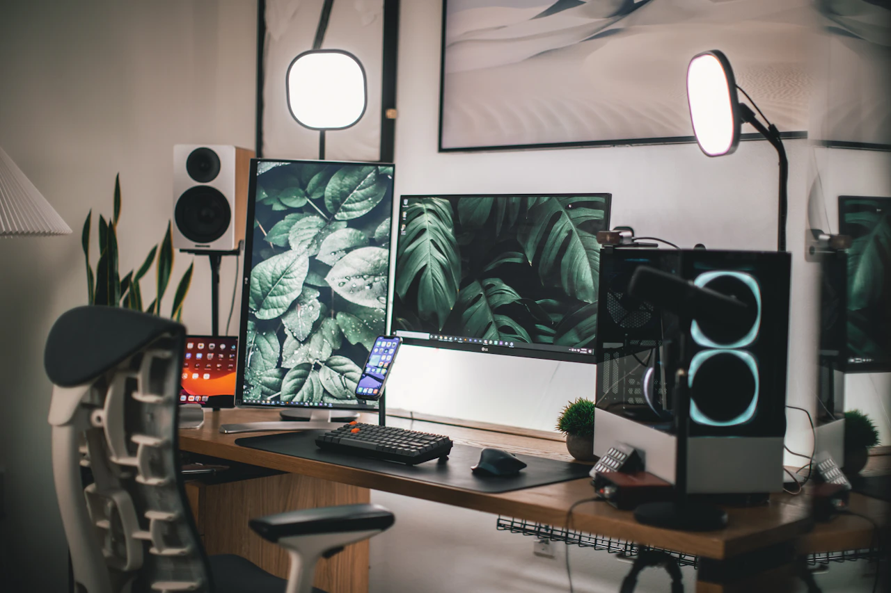 Black computer monitor on a white wooden desk
