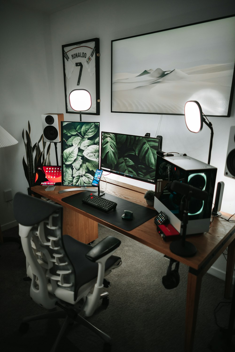 black flat screen computer monitor on brown wooden desk