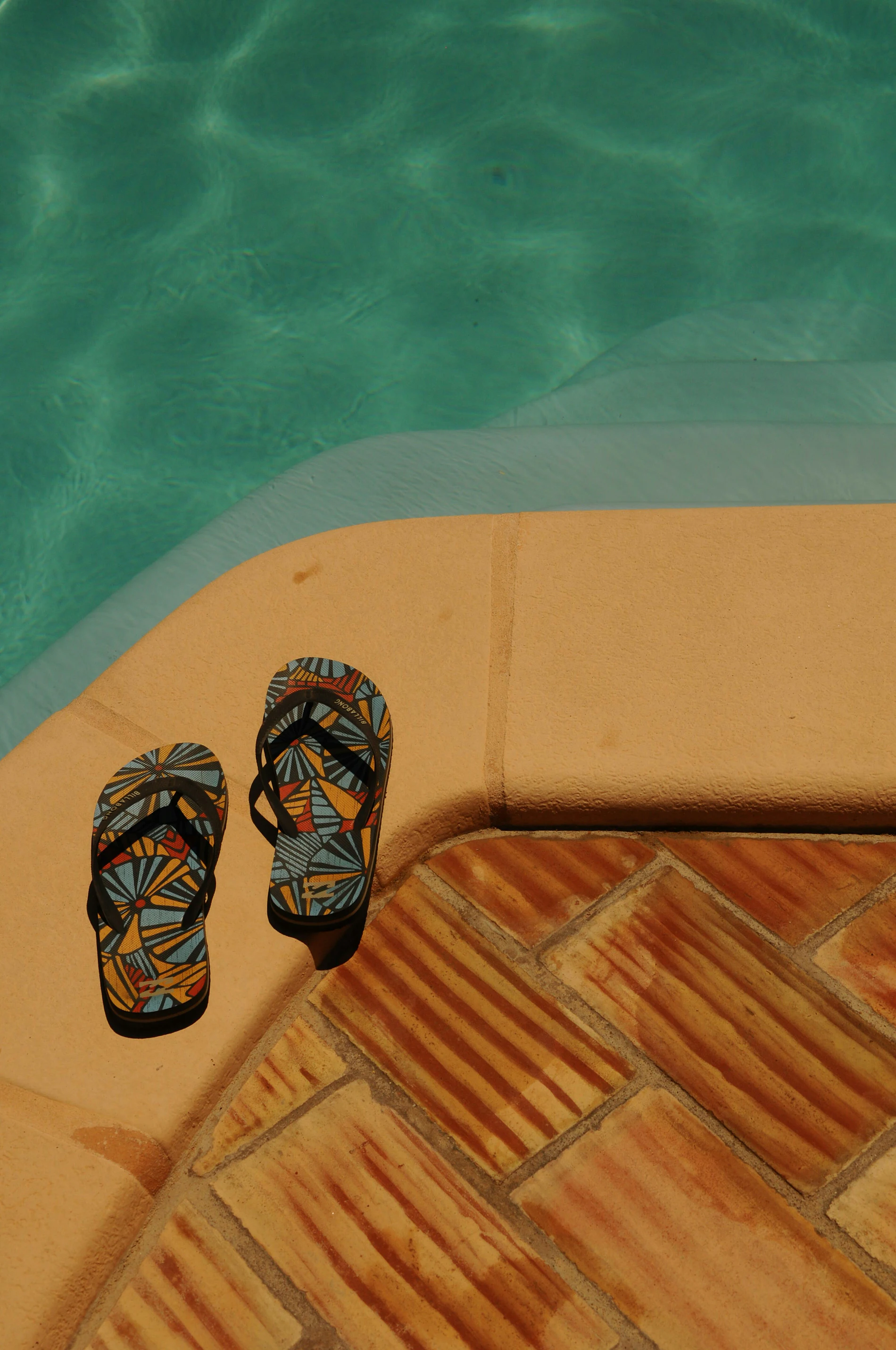 Sandals worn on a concrete step