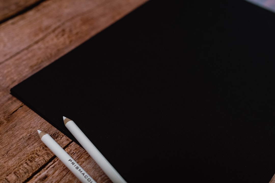 white pen on brown wooden table