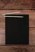 black and white board on brown wooden table