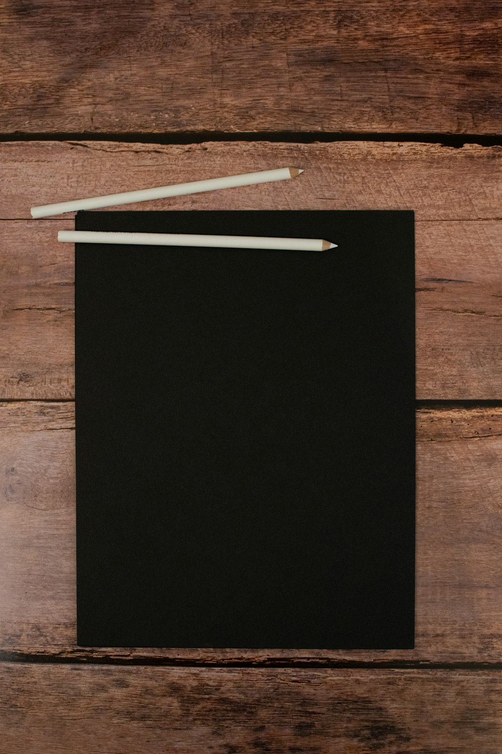 black and white board on brown wooden table