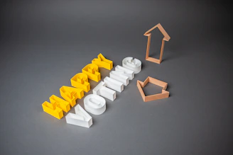 white plastic blocks on gray surface