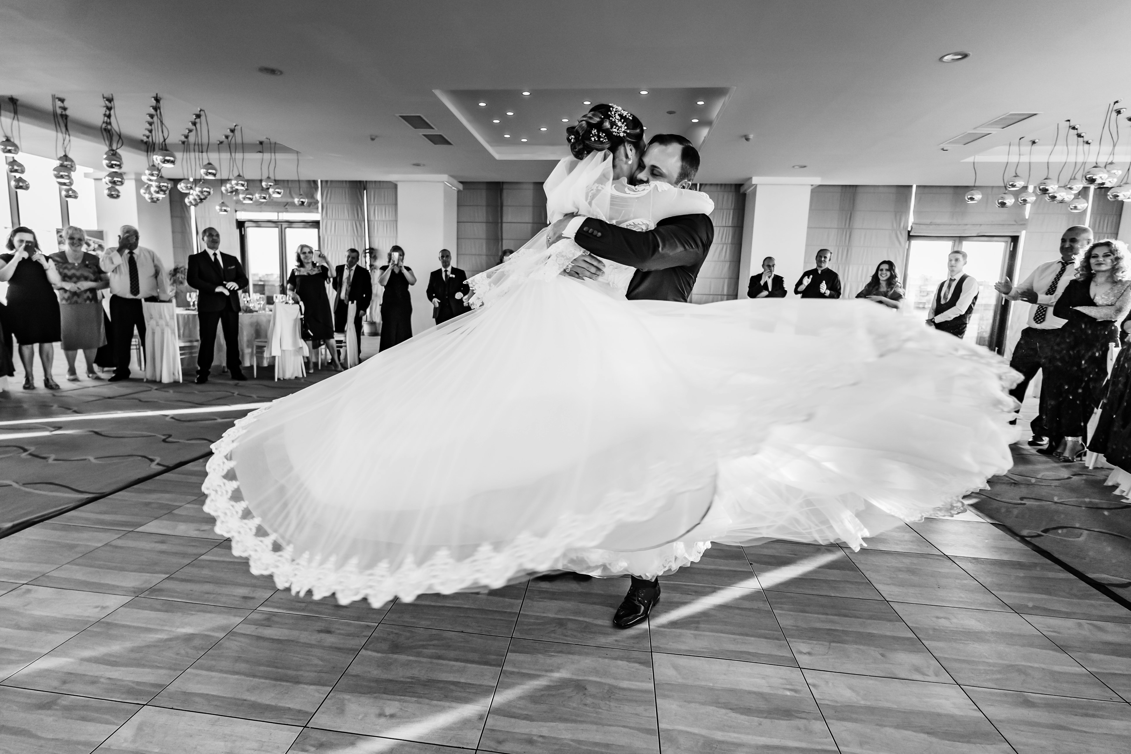 The bride and groom dance together at their wedding reception.