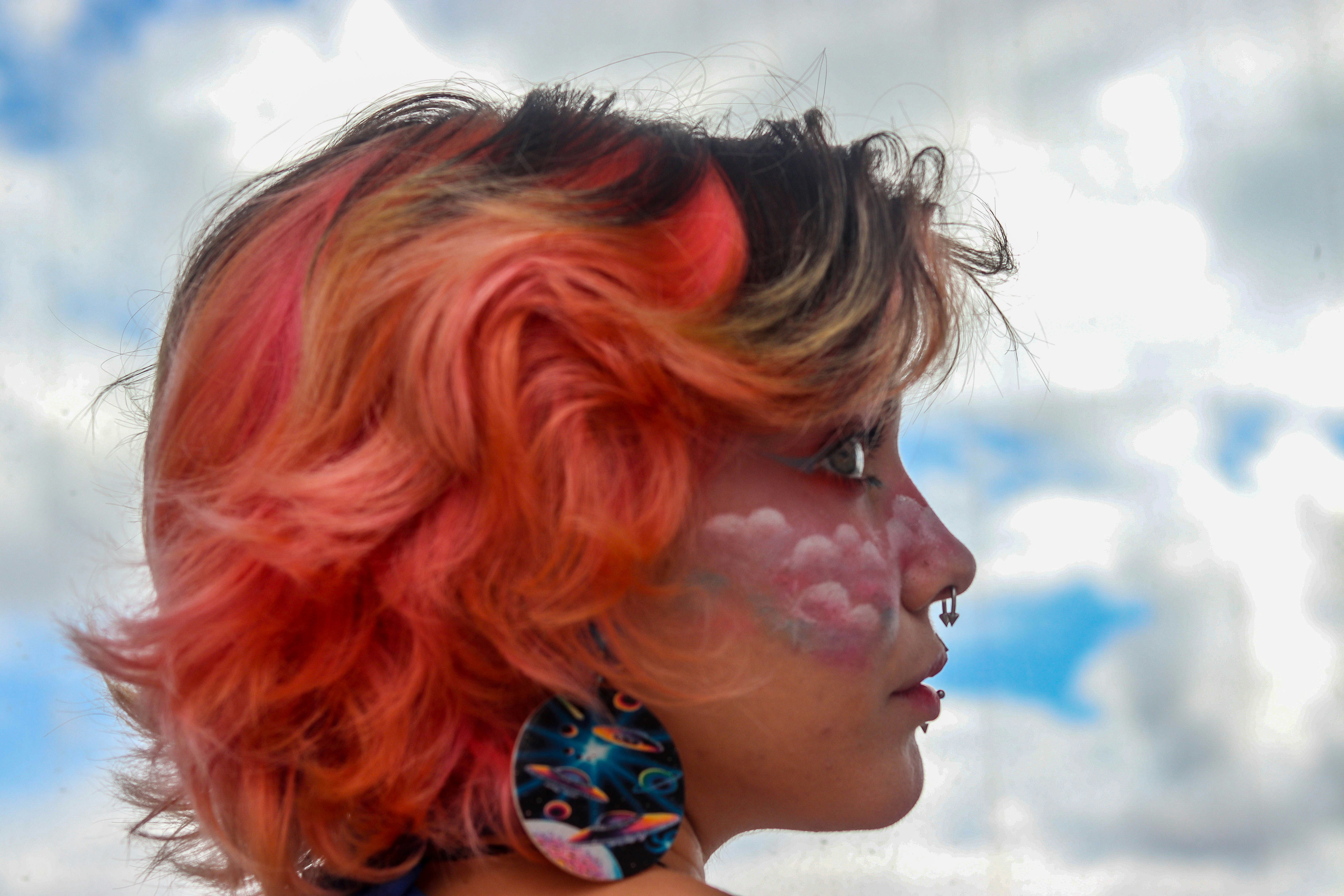 Red, and pink balayage on short wavy hair