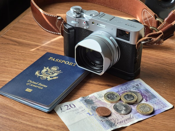 black and silver dslr camera on brown wooden table