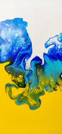 An expressive painting blending deep blues and bright yellows with sweeping strokes.