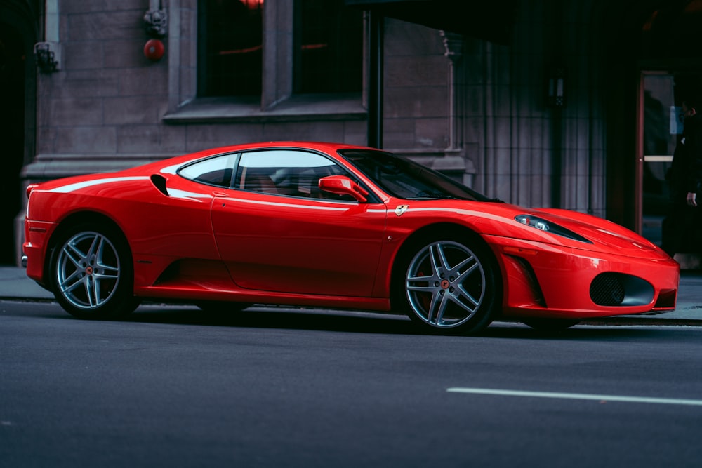 red ferrari 458 italia parked on road