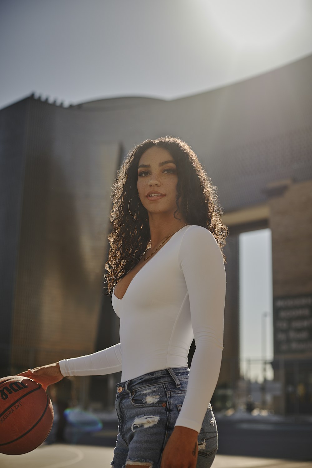 woman in white long sleeve shirt standing