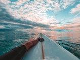 person in black shorts on boat during daytime