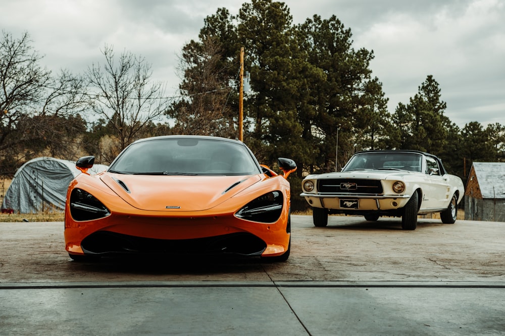 orange lamborghini aventador parked on sidewalk during daytime