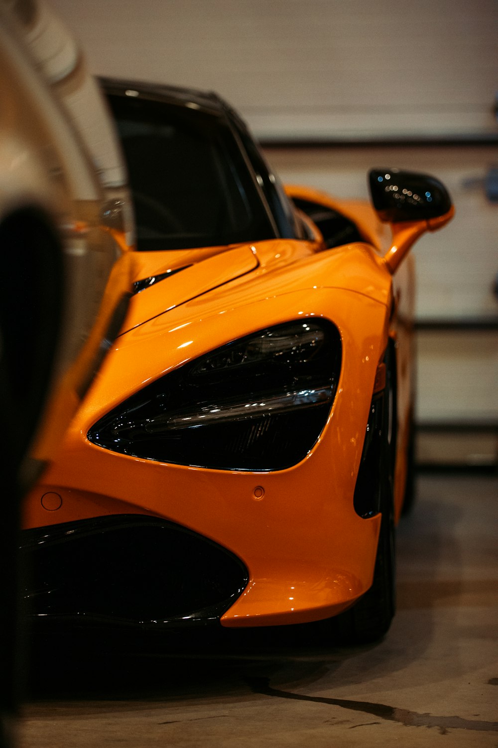 orange car with black and white car