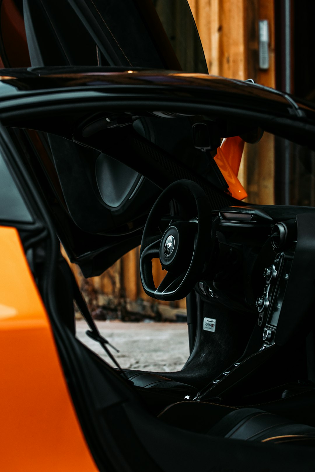 black steering wheel in close up photography