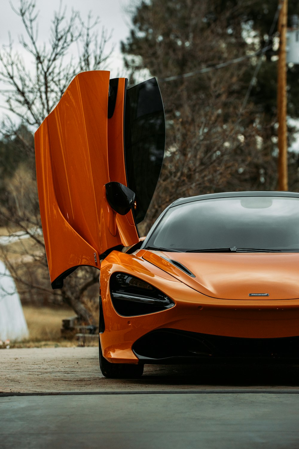 orange car on road during daytime