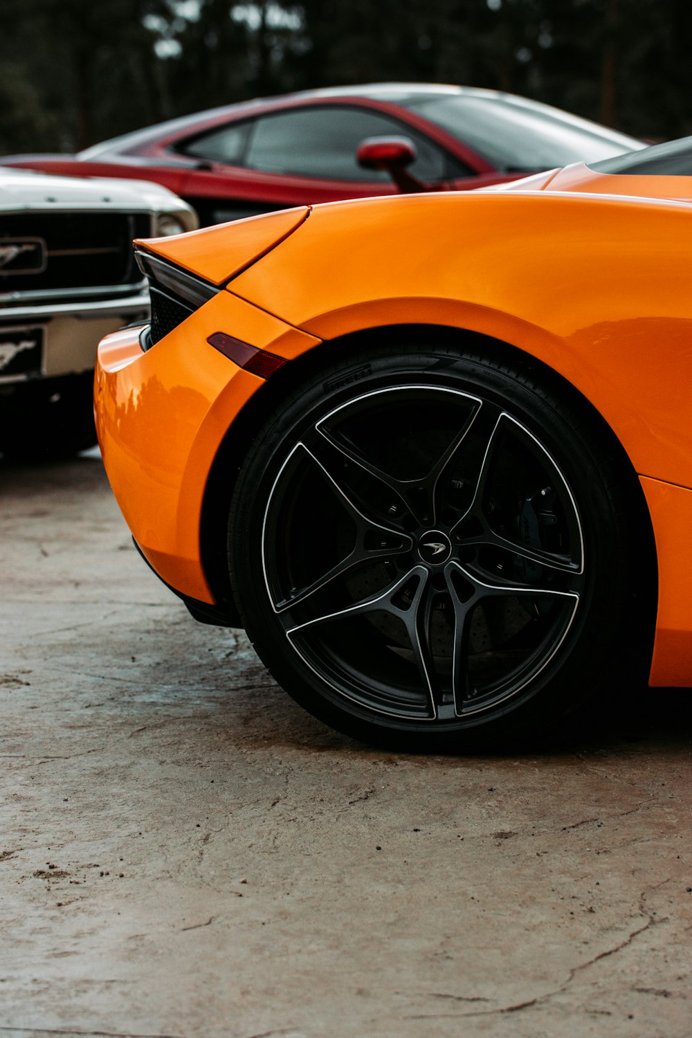 orange car on gray concrete floor