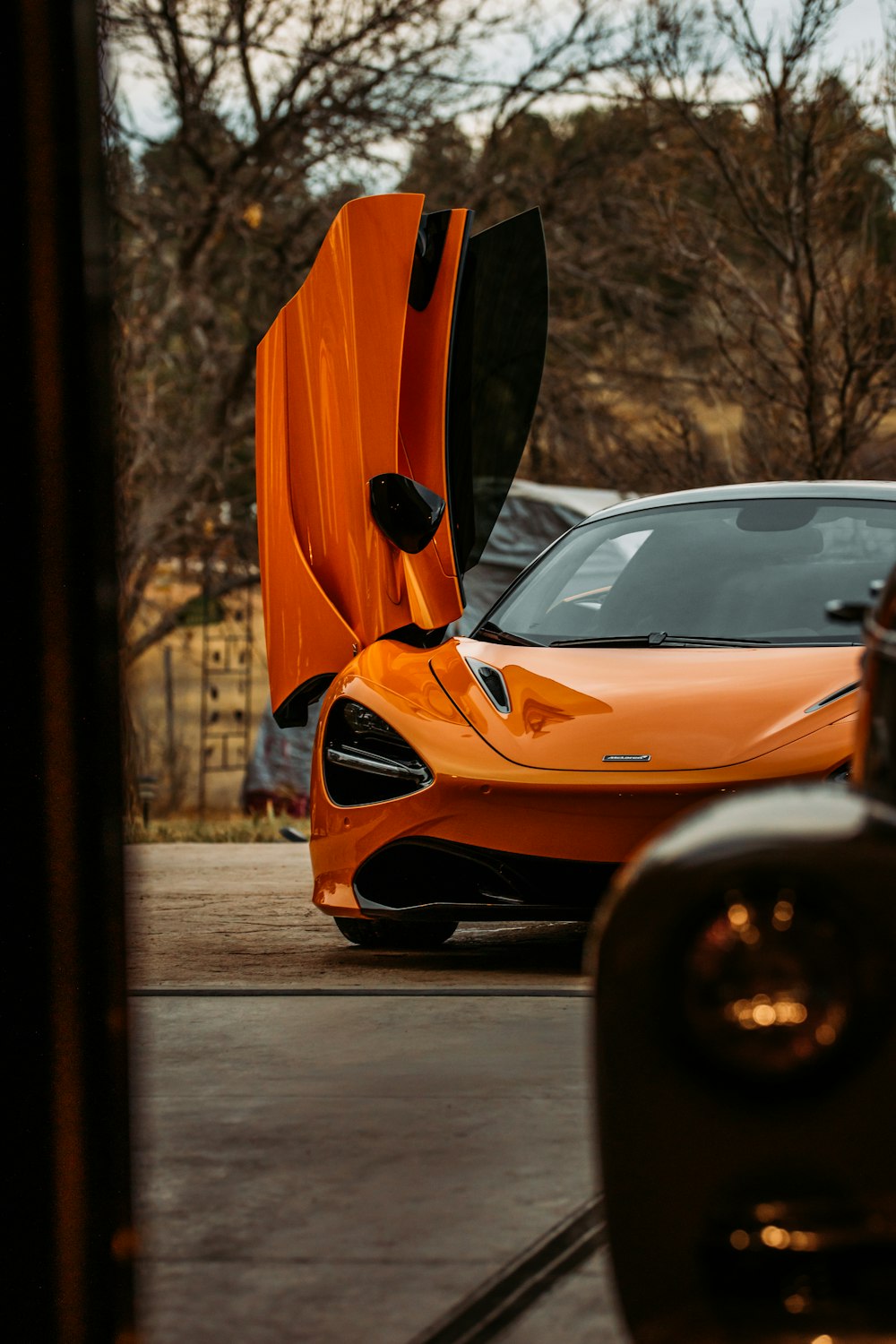 orange ferrari car on road during daytime