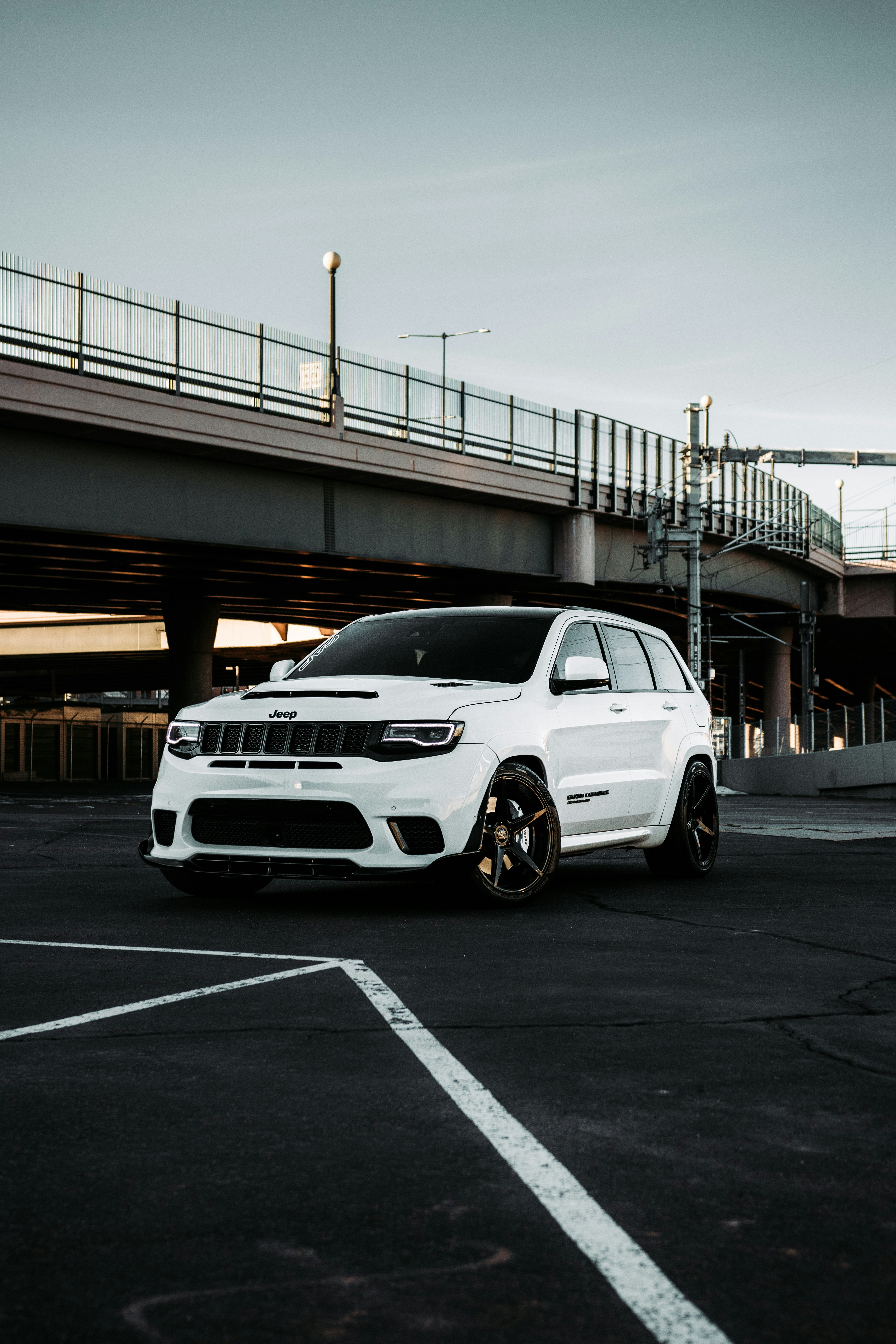 white bmw car on road during daytime