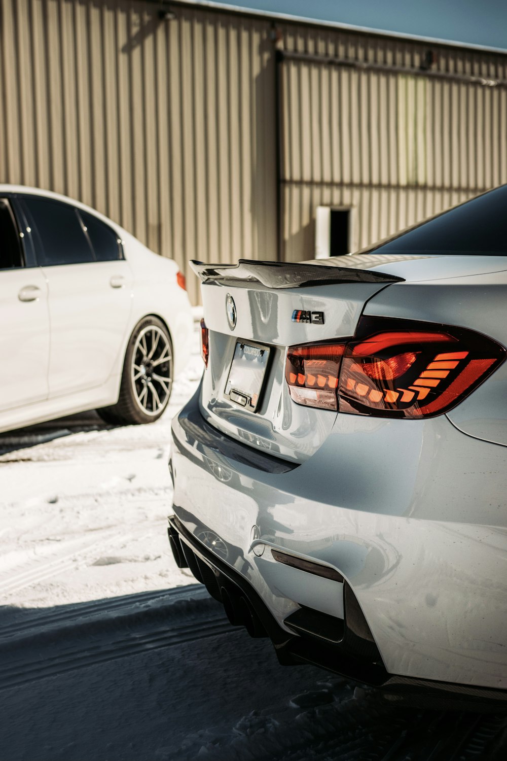 silver honda sedan on snow covered road during daytime