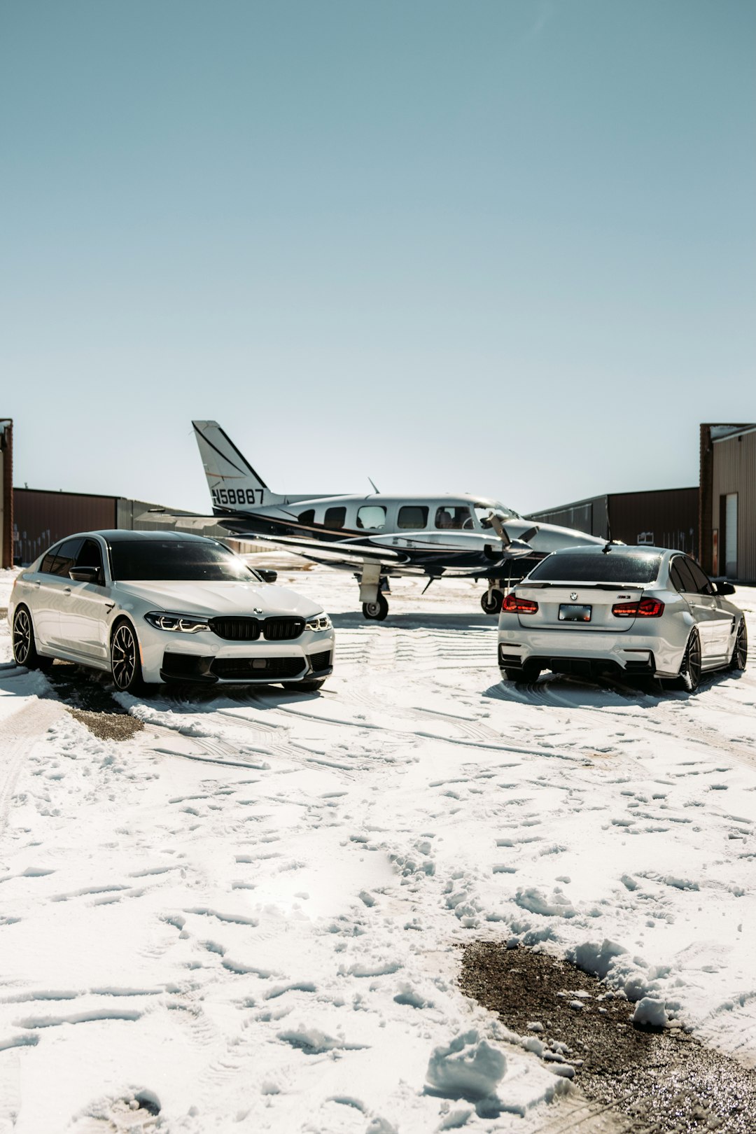 white chevrolet camaro on snow covered ground during daytime