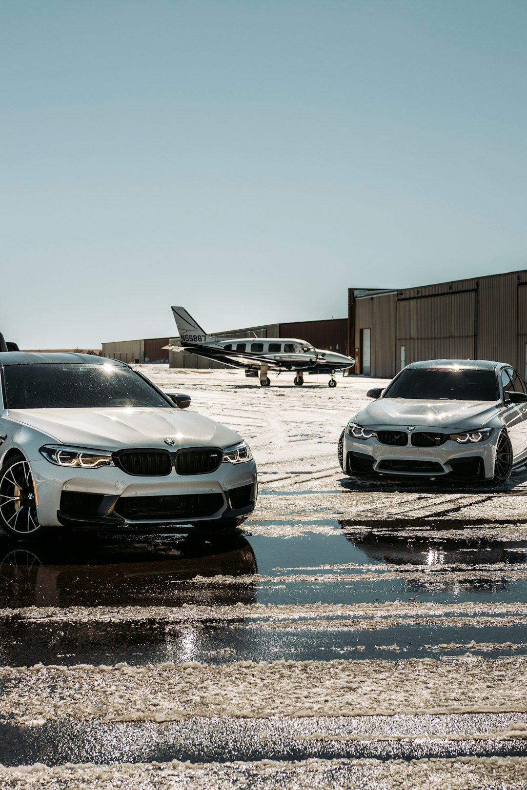 silver bmw car on snow covered ground during daytime