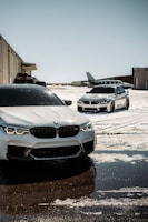 silver bmw car parked on gray concrete floor during daytime