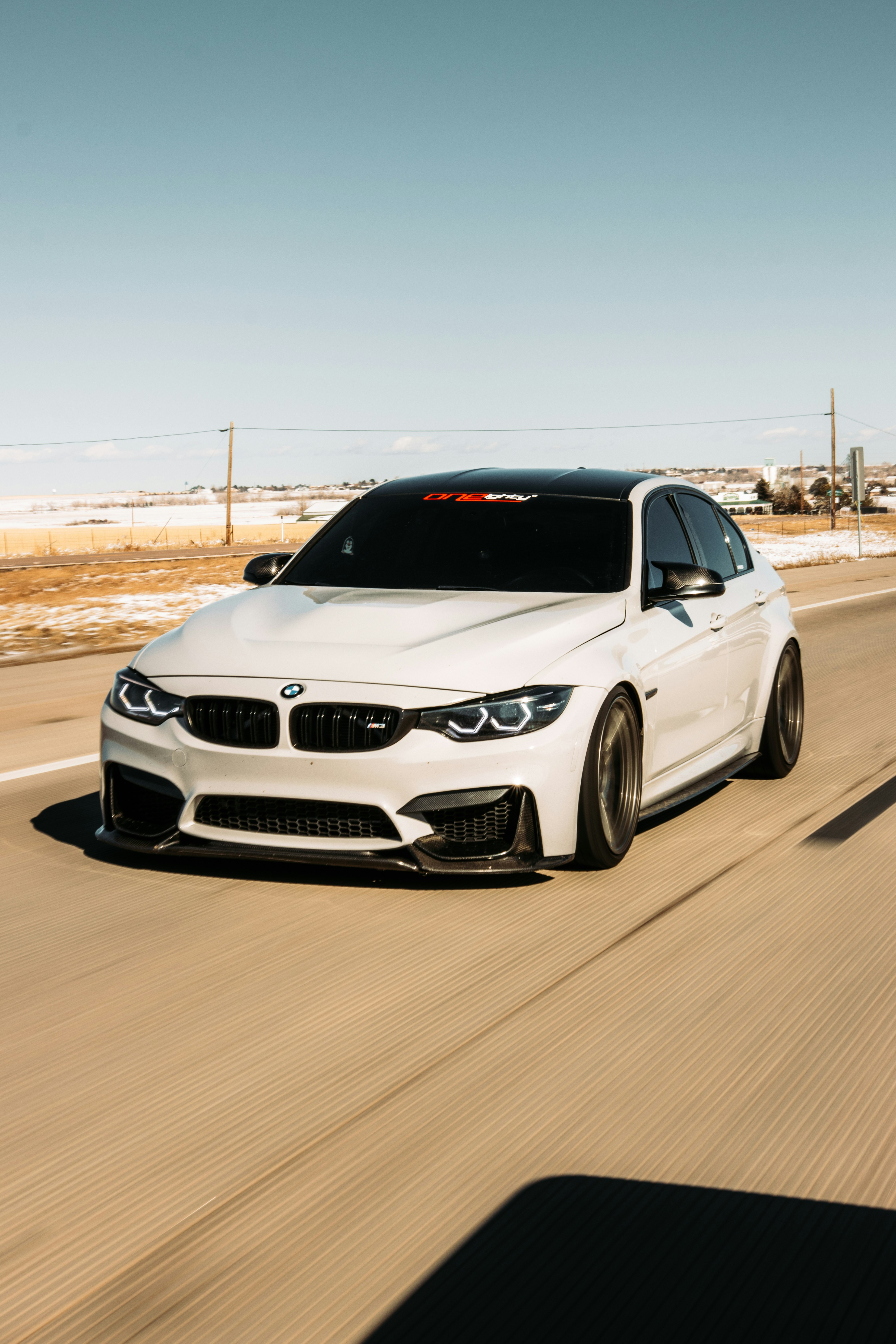 white bmw m 3 on road during daytime