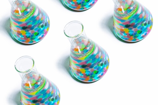 clear glass jar with multi colored heart shaped candies