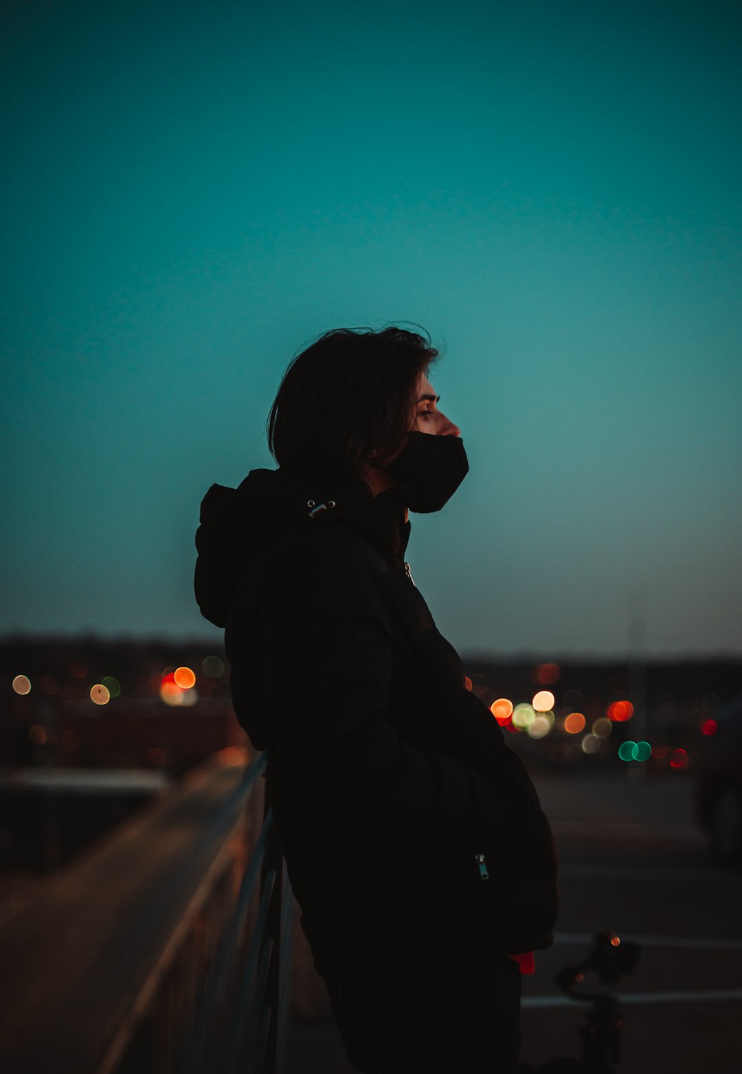 silhouette of woman standing during night time
