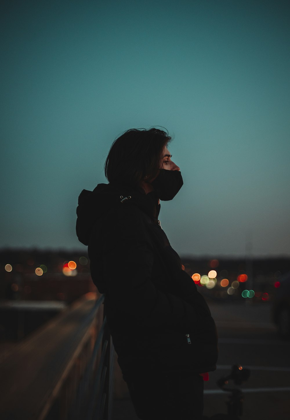 silhouette of woman standing during night time