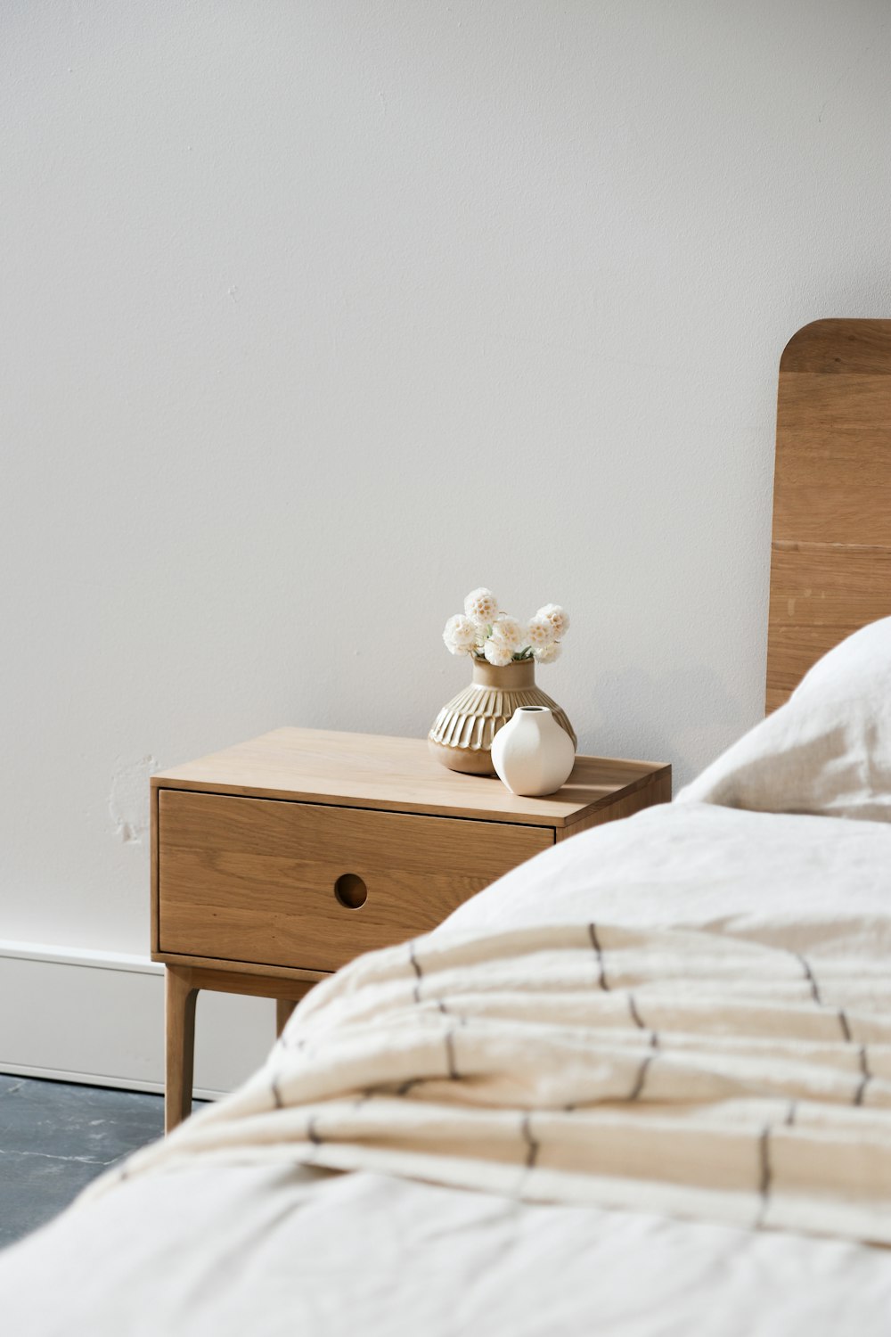 white ceramic rabbit figurine on brown wooden nightstand