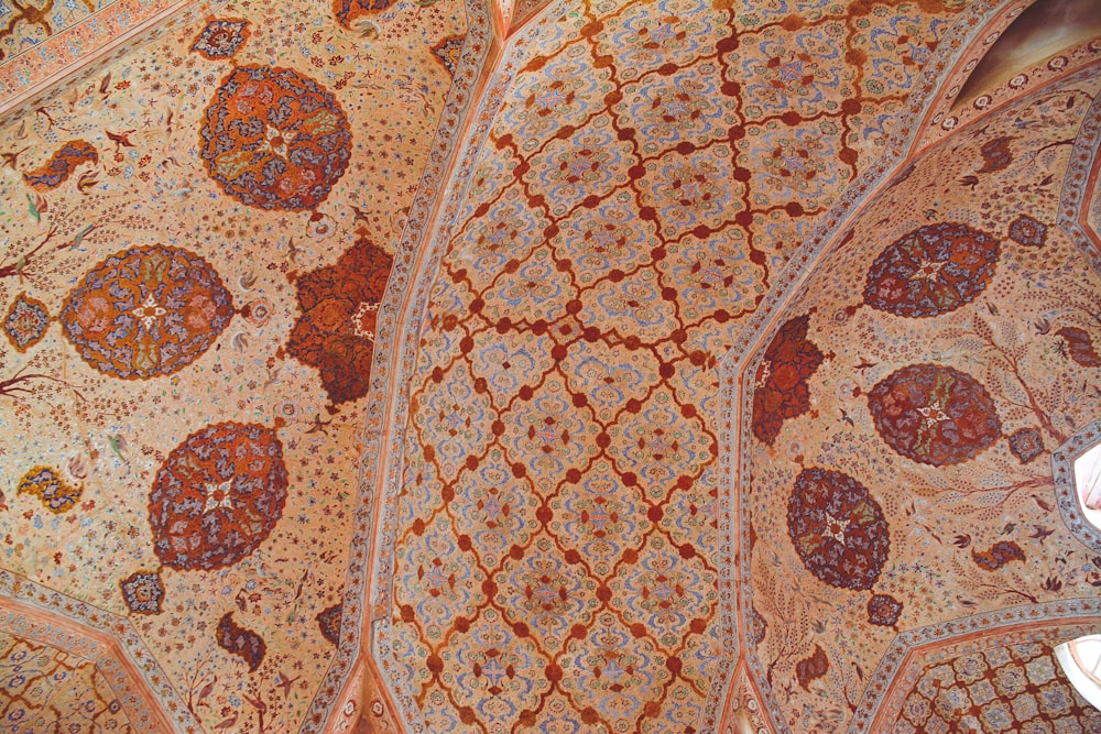 brown and white floral floor tiles