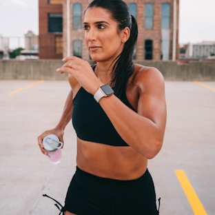 woman in black shorts holding a microphone