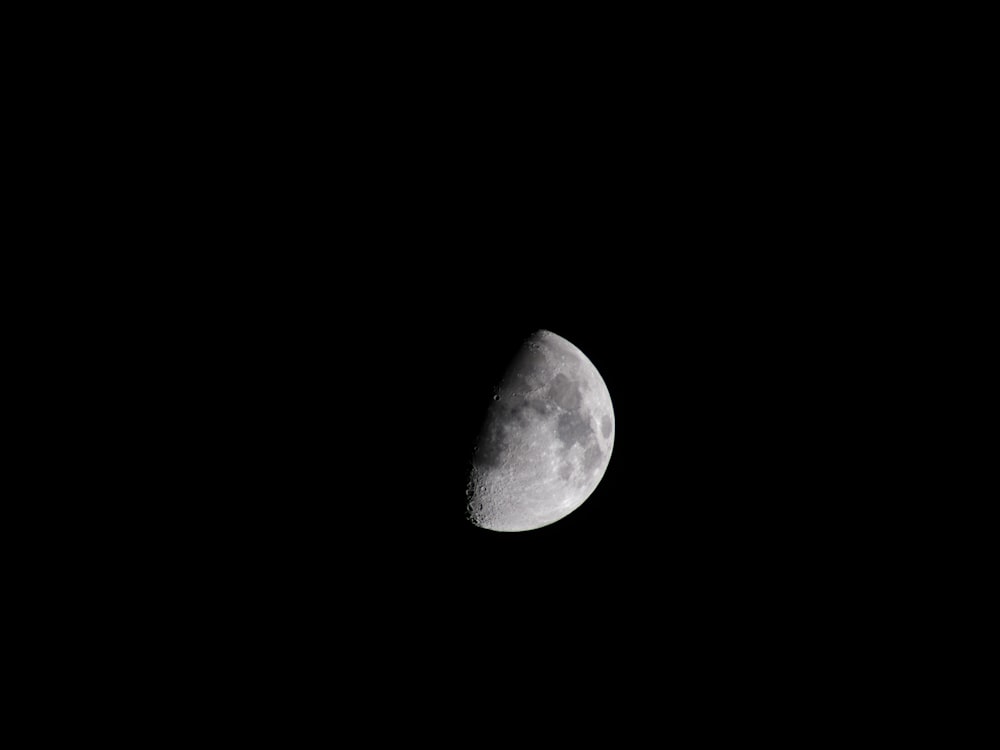 grayscale photo of half moon