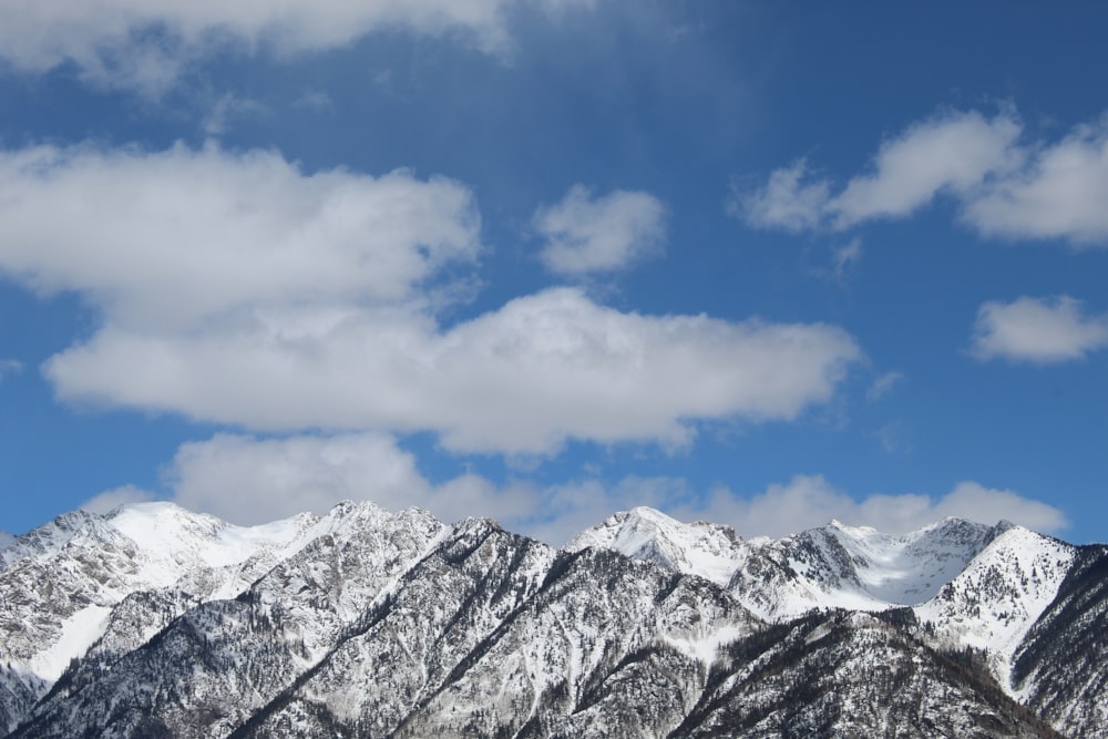 snow covered mountain under blue sky during daytime