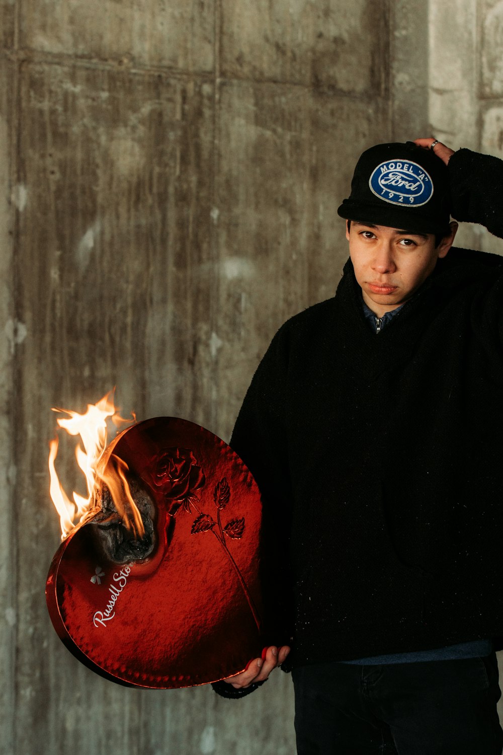 man in black hoodie smoking