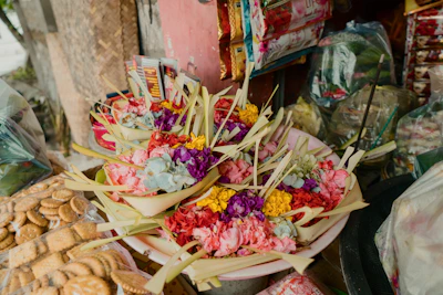 Colorful assortment of flowers arranged in rustic baskets ready for delivery.