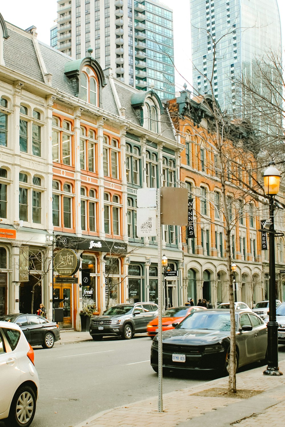 cars parked in front of building during daytime